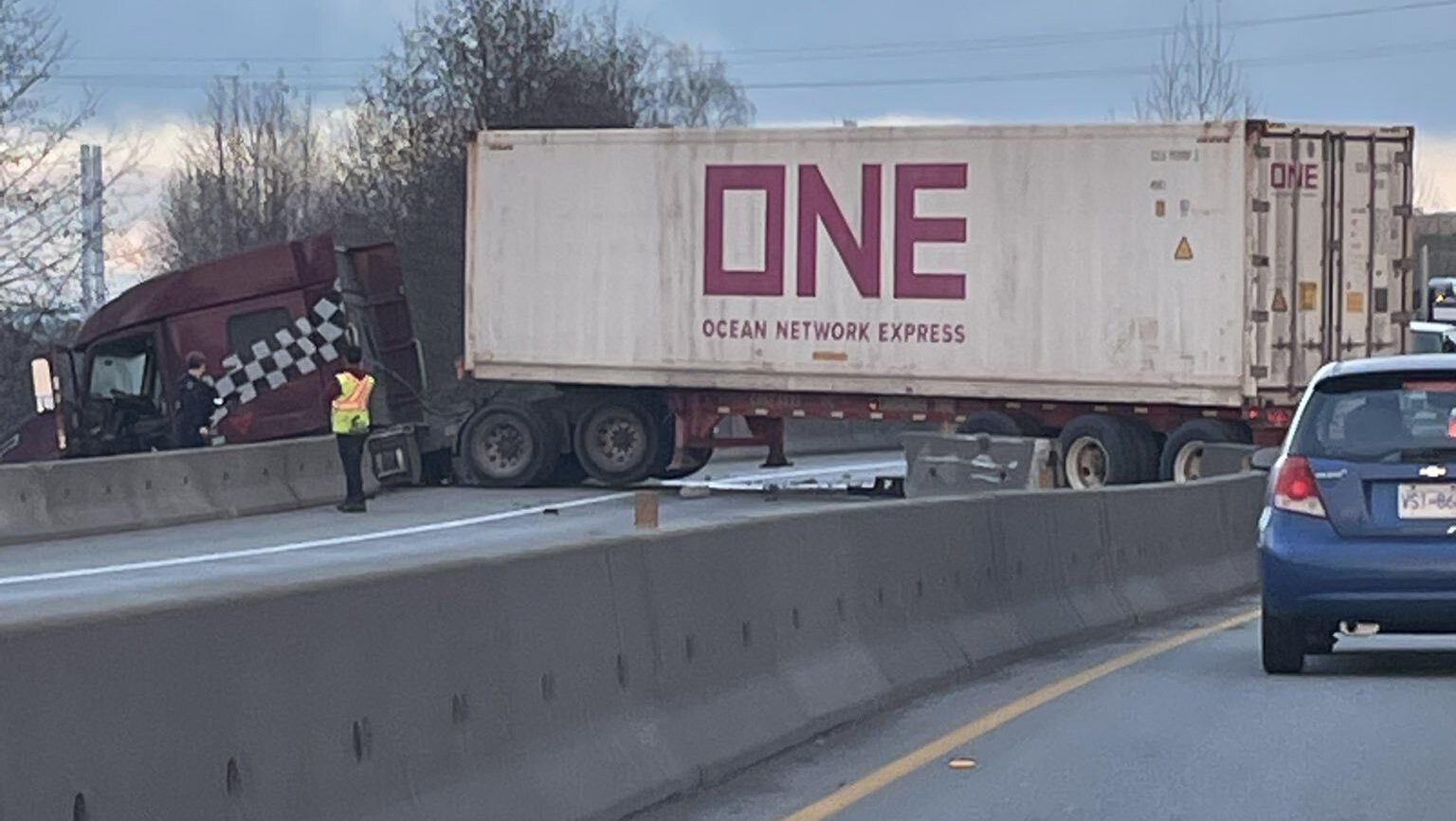 A semi truck blocking lanes of a highway