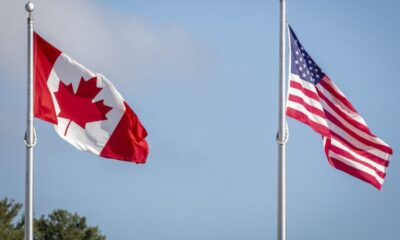 American and Canadian flag at the U.S./Canada border crossing at the Thousand Islands border in Lansdowne, Ont., on Nov. 8, 2021