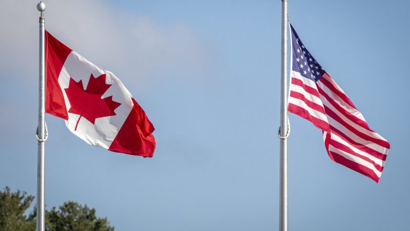 American and Canadian flag at the U.S./Canada border crossing at the Thousand Islands border in Lansdowne, Ont., on Nov. 8, 2021