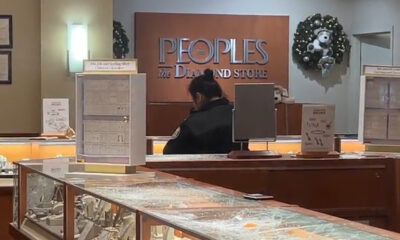 Smashed display cases are seen at the Peoples Jewellers inside Centerpoint Mall in North York