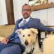 Captain (Ret.) Andrew Gough with his service dog Riggs.