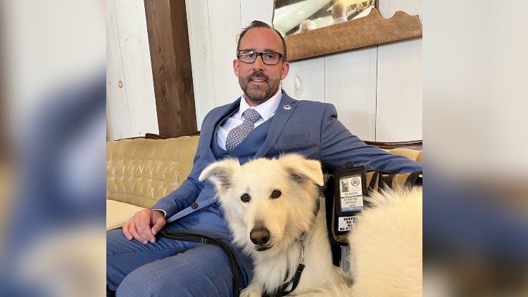 Captain (Ret.) Andrew Gough with his service dog Riggs.