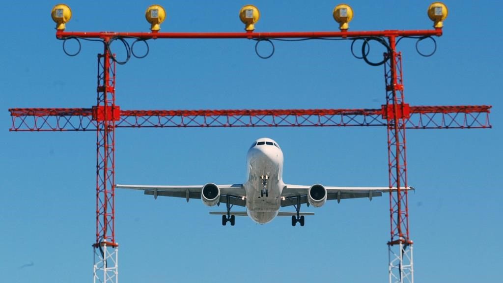 An airplane prepares to land at Pearson International Airport in Toronto