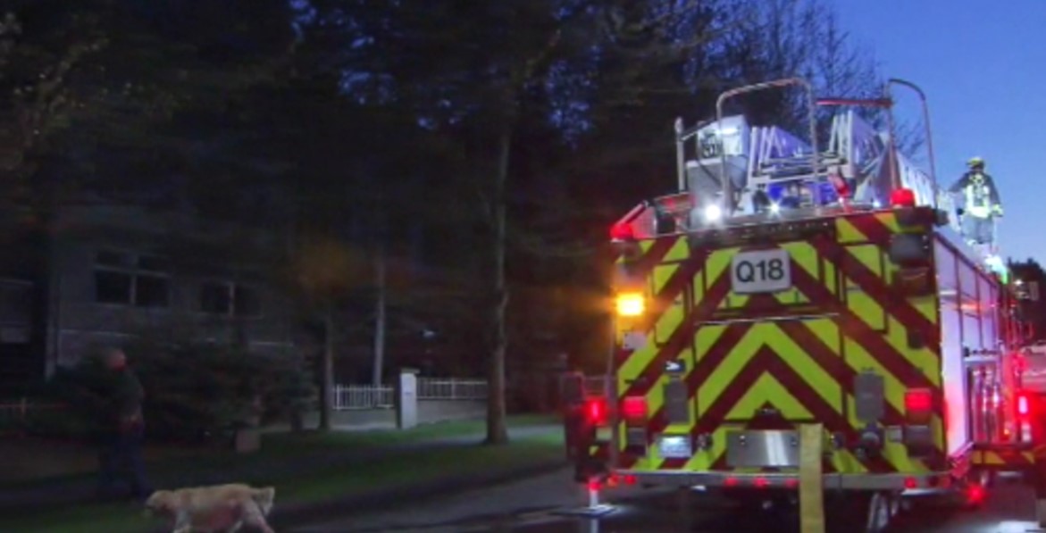 A fire engine is visible at the site of a fire in a condo building in Surrey on April 25, 2025.
