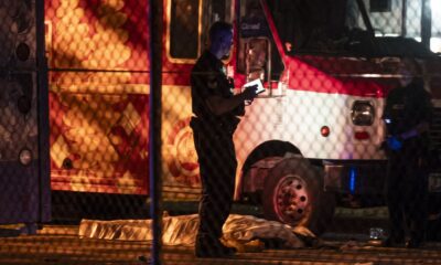 A victim lies near a food truck after a car drove into a crowd at the Lapu Lapu Festival in Vancouver on Saturday April 26, 2025. THE CANADIAN PRESS/Rich Lam
