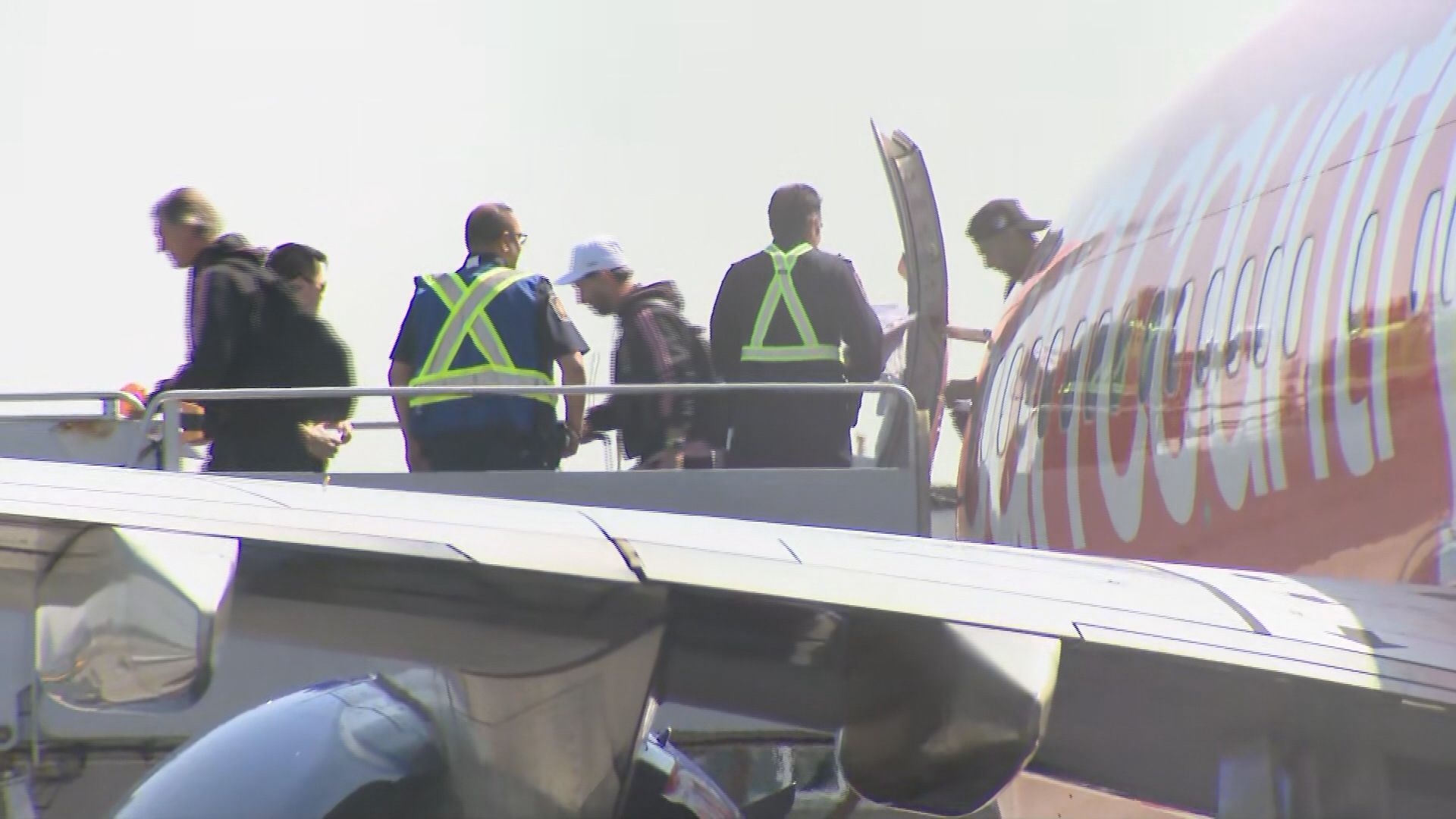 Lionel Messi disembarks a plane.