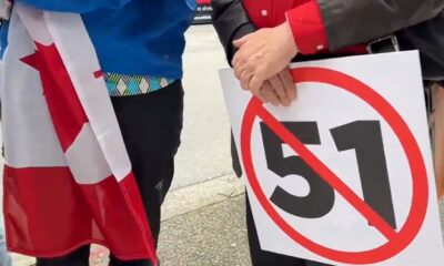 Americans and Canadians protested outside the U.S. consulate in Vancouver on June 14, 2025.