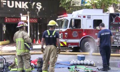 Crews battled a blaze at Vancouver's Funky Winker Beans pub and a nearby SRO July 17, 2025.