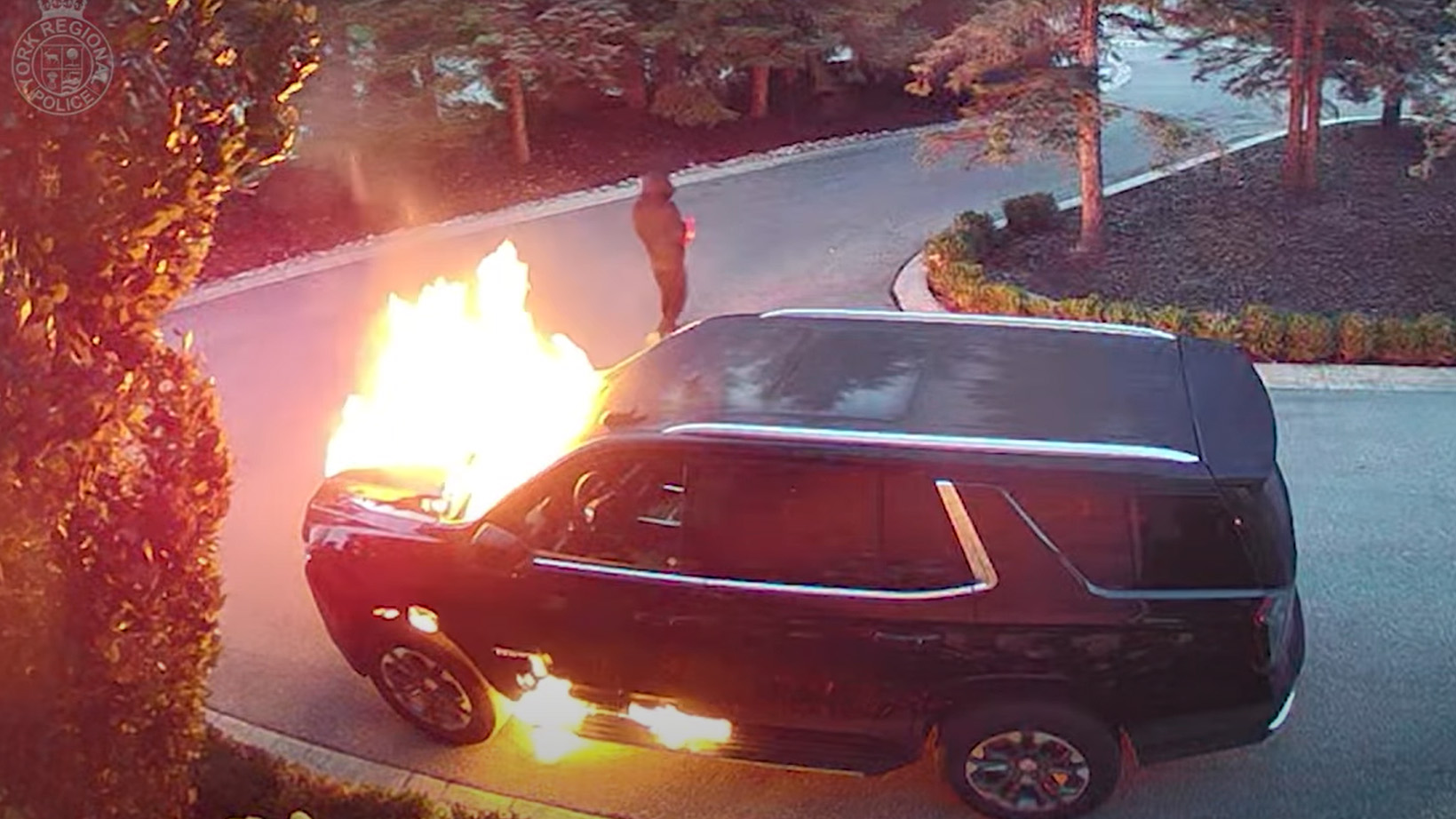 Security photos of a man wanted for allegedly setting fire and shooting a vehicle in Vaughan.