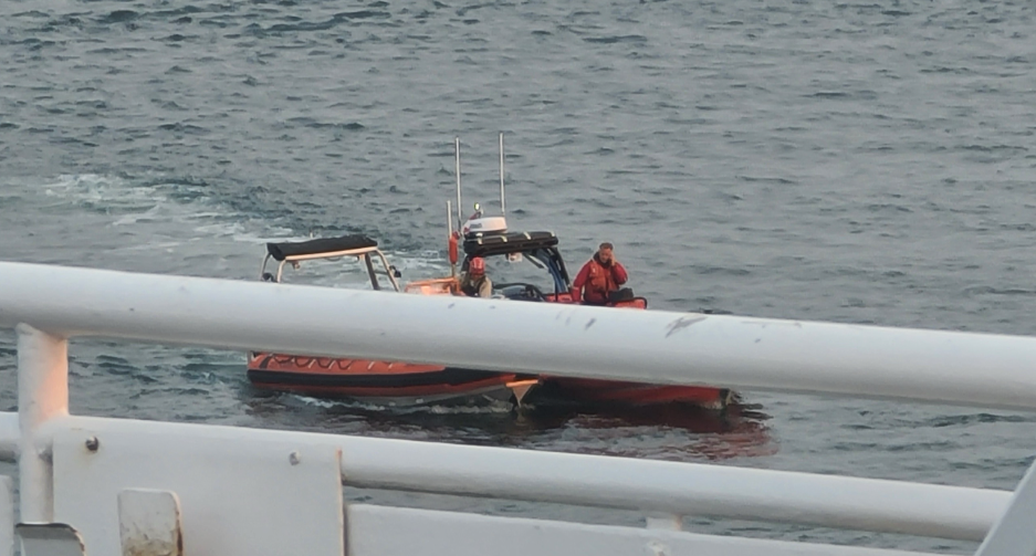 An image taken by a passenger aboard a BC Ferries vessel on Sept. 4, 2025, shows a marine rescue in progress.