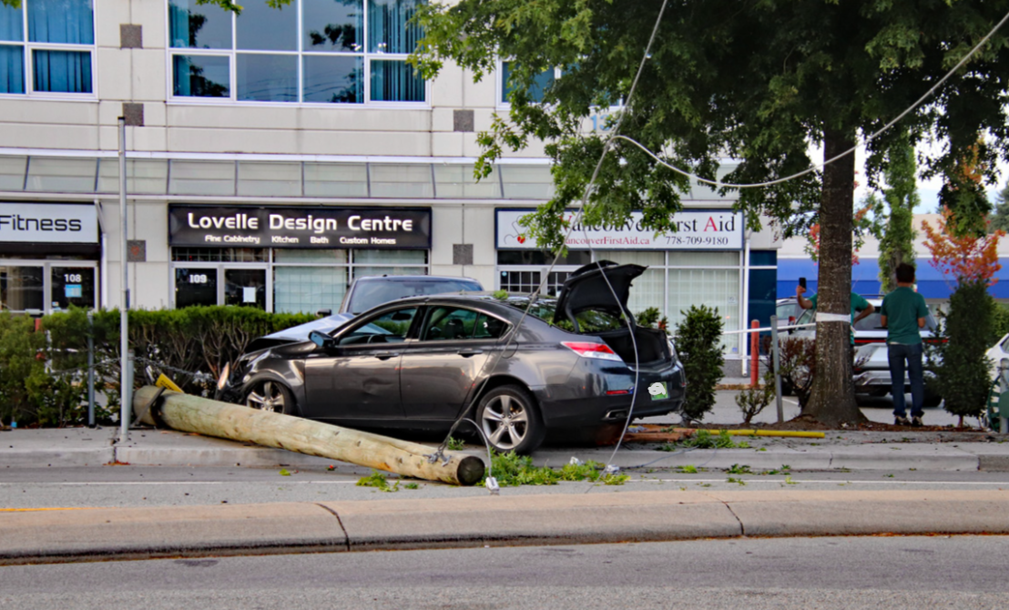 Two people waiting for a bus were injured after a vehicle drove off the road into a hydro pole Saturday evening, the Surrey Police Service (SPS) says.