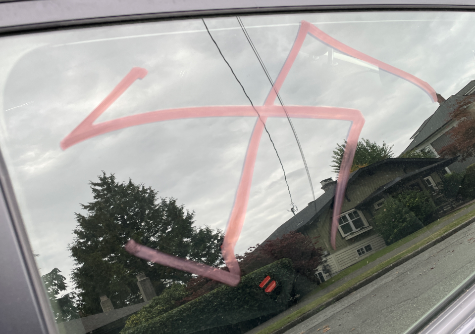 The New Westminster Police Department is asking the public for help identifying a suspect after swastikas were drawn on multiple vehicles within the last week.
